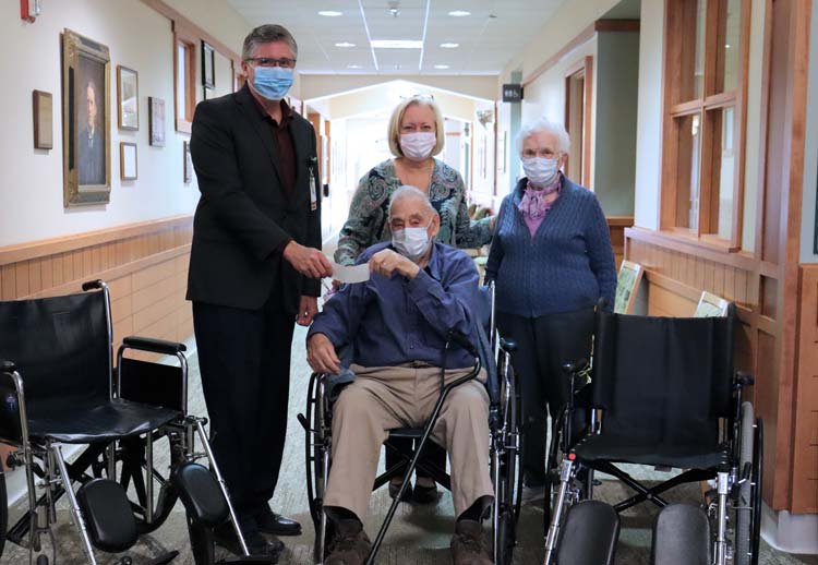 Littleton residents and patients of Littleton Regional Healthcare, Perry and Eschol Goodell, provide funding to support the purchase of 12 brand new wheelchairs at LRH